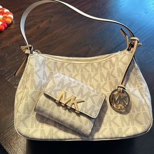 Signature Michael Kors purse & matching wallet.